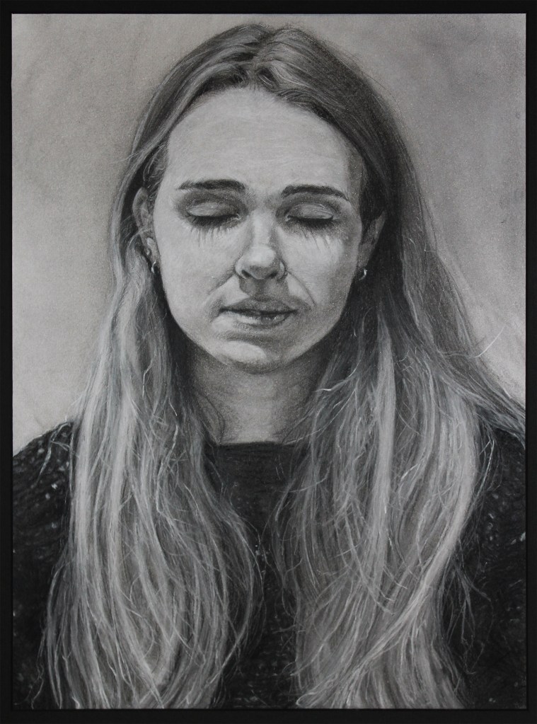 charcoal portrait of a woman with her eyes closed